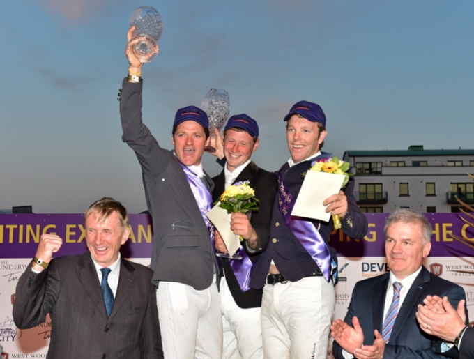 Wexford's Jason Higgins shares winner's prize in Puissance at Jumping in the City